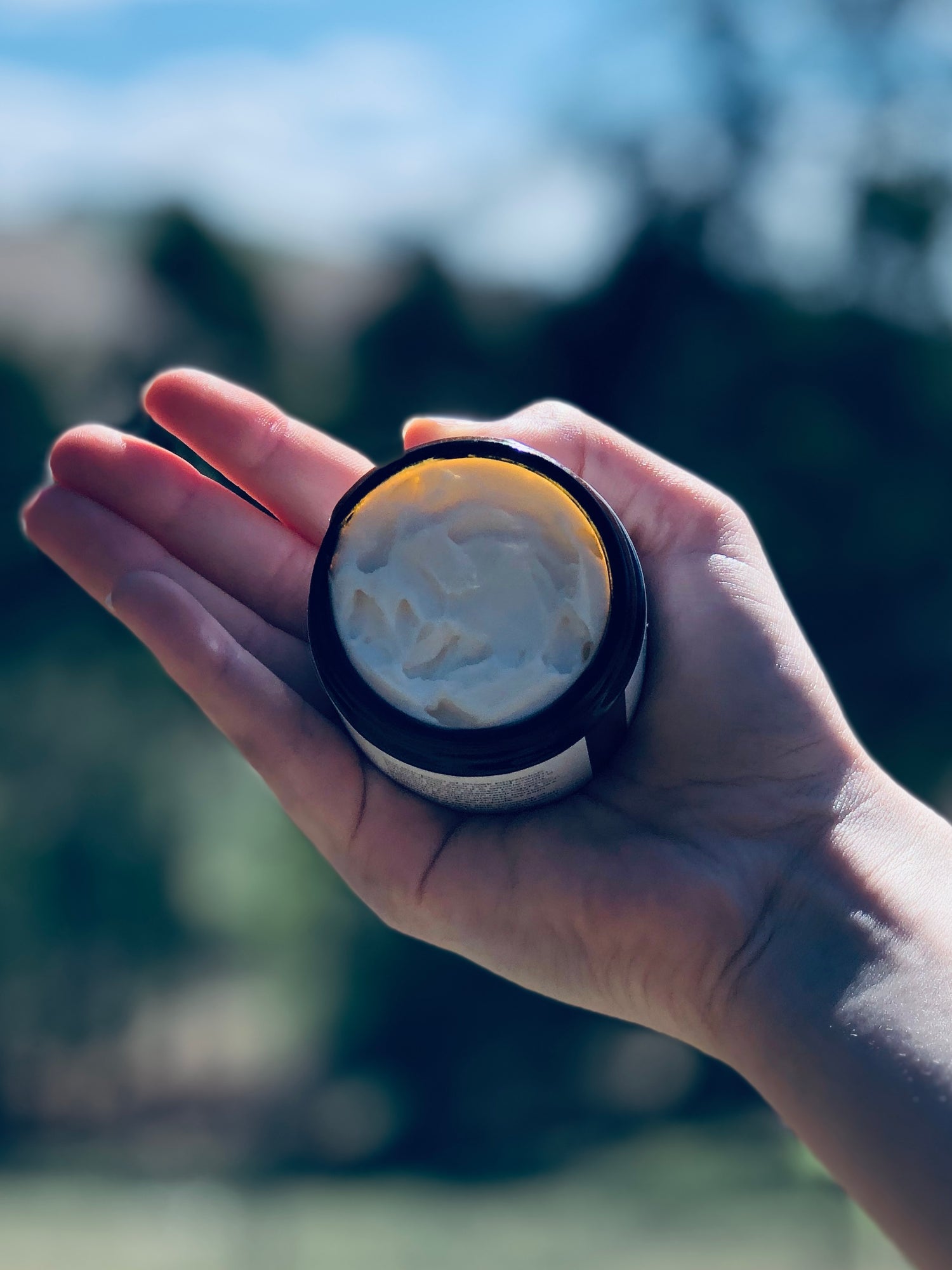 Small Batch Natural Skincare Made in the Gippsland Hills Victoria Australia. Charlie & I. Product being held in hand is Galen's Cold Cream